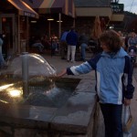 Kendra playing in a fountain in November