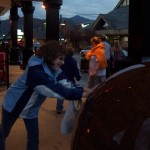 Kendra rolling a giant stone ball