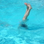 Kendra doing a handstand in one of the pools