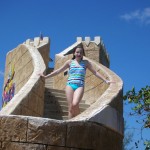 Kendra on the stairs to the slide at the pool