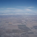 Flat Land in Denver and mountains in the distance